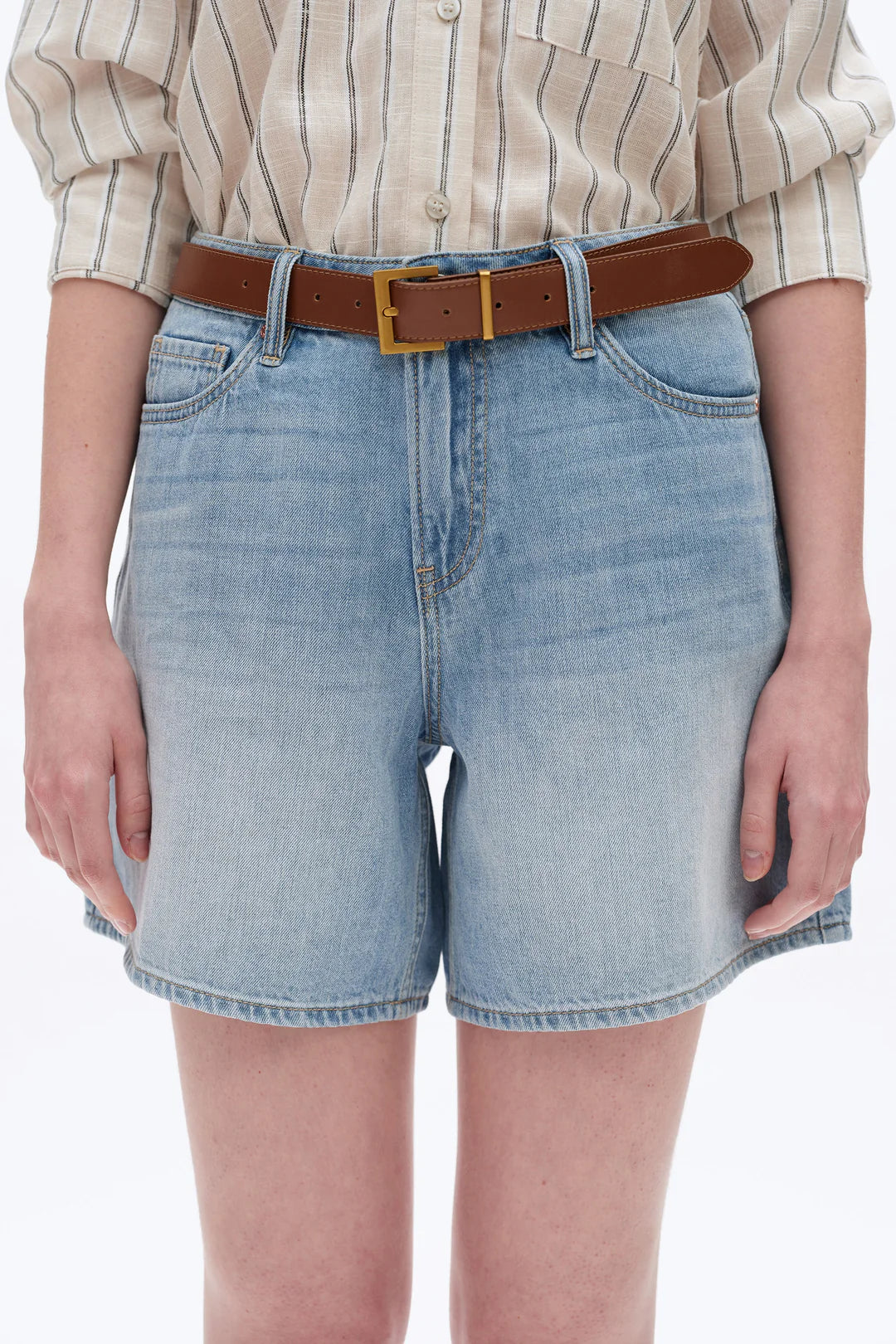Bayeas Mid Rise Relaxed Denim Shorts Person wearing light blue denim shorts with a brown belt on a white background