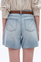 Bayeas Mid Rise Relaxed Denim Shorts Light blue denim shorts worn by a person on a white background