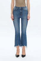 Rita High Rise Frayed Hem Ankle Flare Jeans Person wearing blue flared jeans on a white background