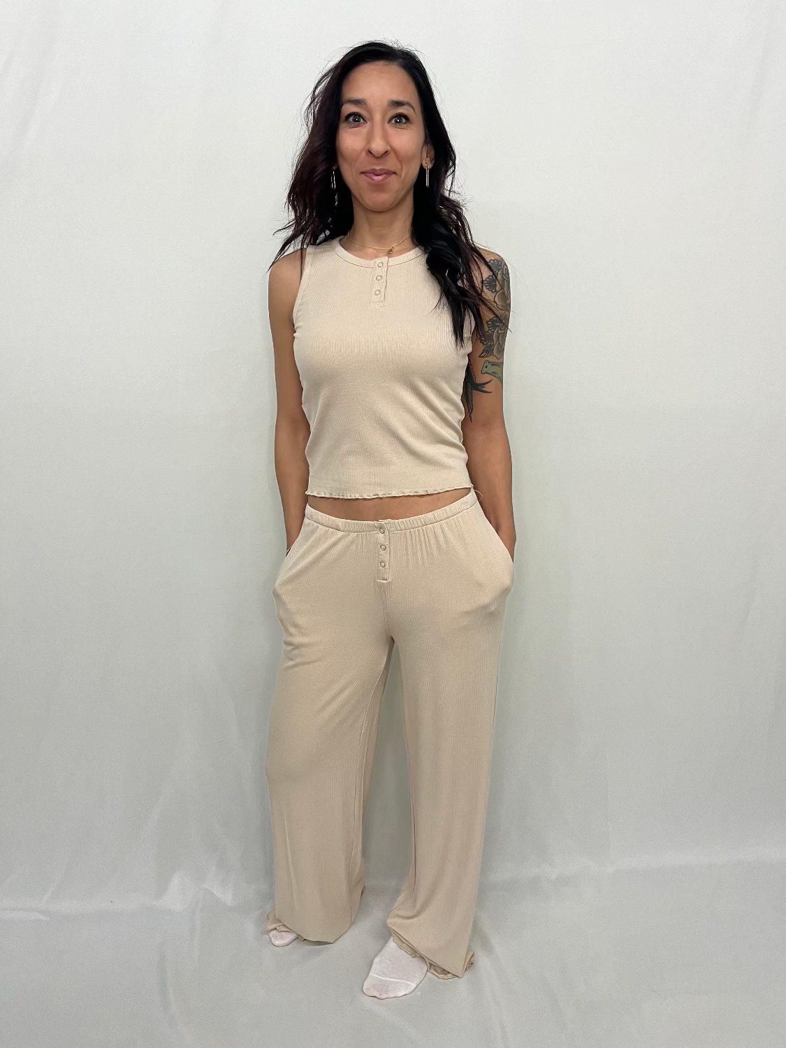 Bamboo Blend High-Rise Lounge Pants – Sand Beige Woman wearing a beige sleeveless top and pants against a white background